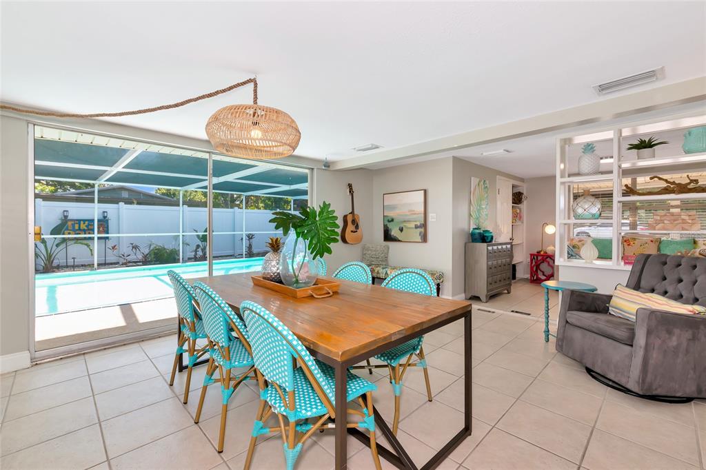 5948 Mirror Lake Road Sarasota, FL 34233 - Photo 29 of 50 a view of a dining room with furniture and wooden floor