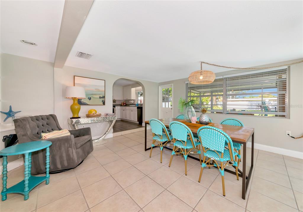 5948 Mirror Lake Road Sarasota, FL 34233 - Photo 30 of 50 a living room with furniture and a table