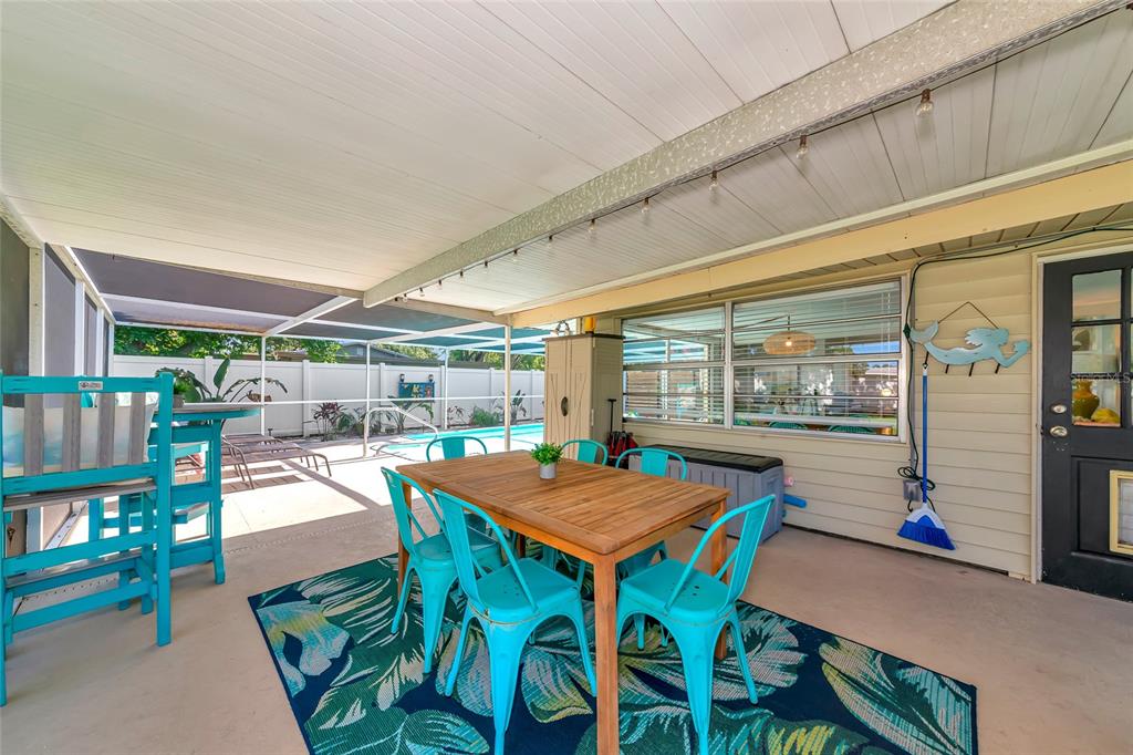 5948 Mirror Lake Road Sarasota, FL 34233 - Photo 32 of 50 a outdoor dining space with furniture and outdoor view