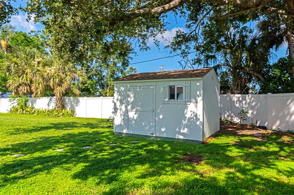 5948 Mirror Lake Road Sarasota, FL 34233 - Photo 37 of 50 a view of a back yard with green space