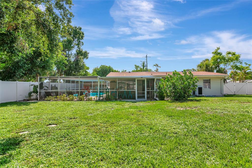 5948 Mirror Lake Road Sarasota, FL 34233 - Photo 38 of 50 a front view of a house with garden