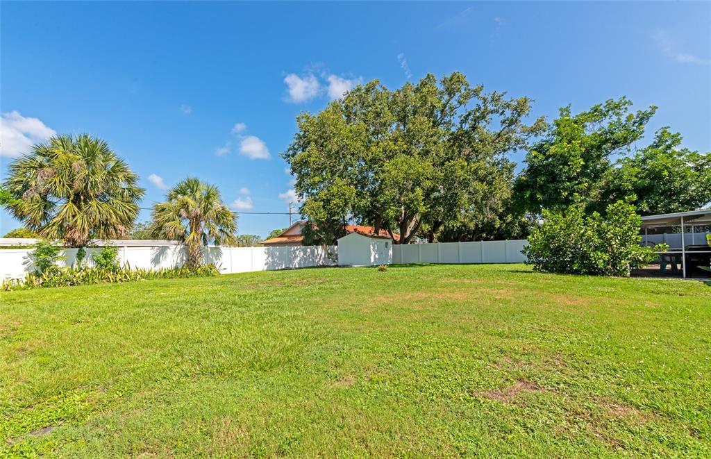 5948 Mirror Lake Road Sarasota, FL 34233 - Photo 39 of 50 a view of a field of grass and trees