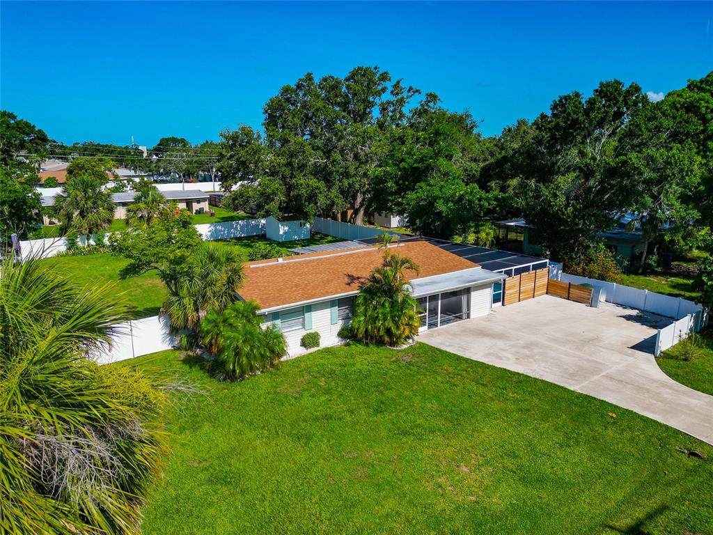 5948 Mirror Lake Road Sarasota, FL 34233 - Photo 41 of 50 an aerial view of residential houses with outdoor space and trees