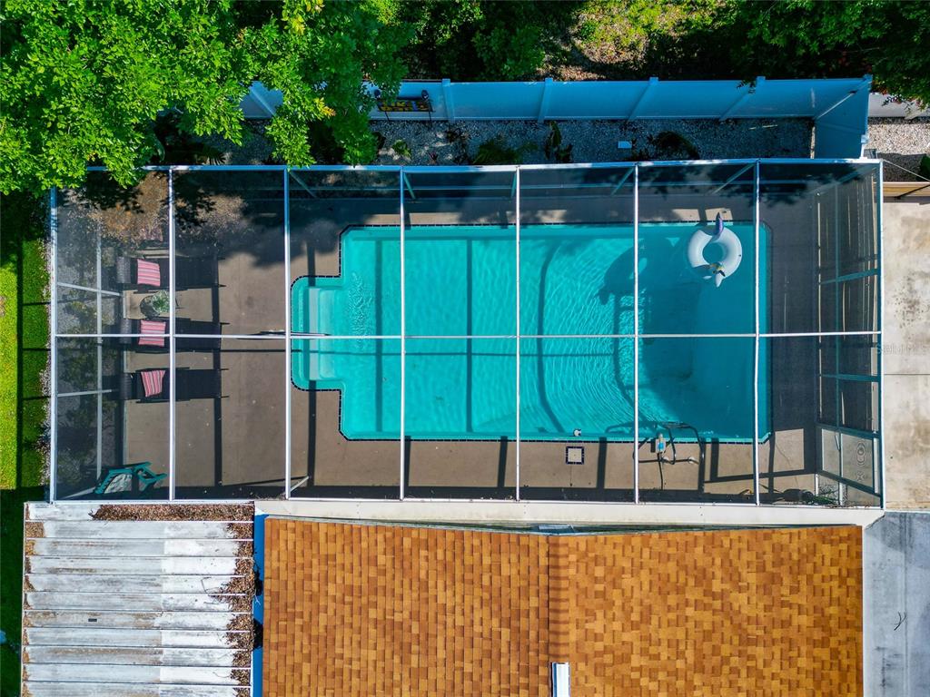 5948 Mirror Lake Road Sarasota, FL 34233 - Photo 42 of 50 a view of a backyard with a wooden fence