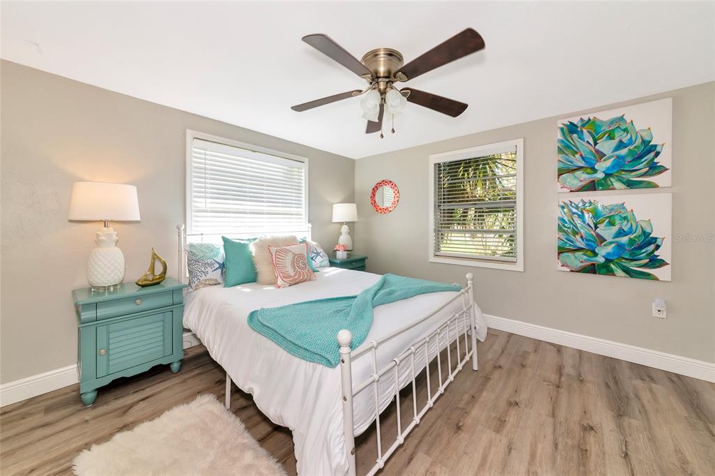 5948 Mirror Lake Road Sarasota, FL 34233 - Photo 8 of 50 a bed sitting in a bedroom next to a window