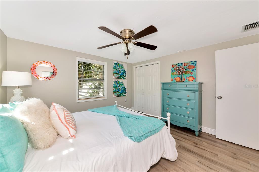 5948 Mirror Lake Road Sarasota, FL 34233 - Photo 9 of 50 a bedroom with a bed and a window