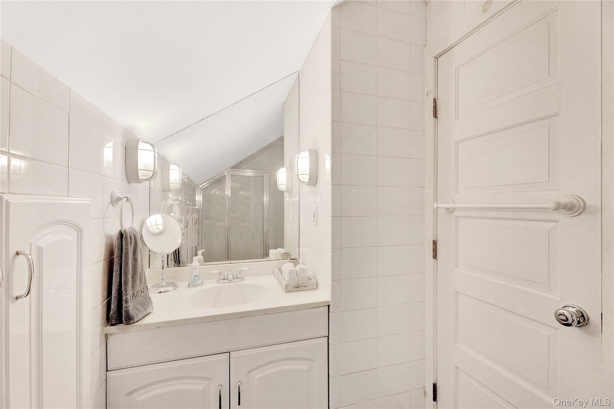 198 South Country Road Remsenburg, NY 11960 - Photo 29 of 49 a bathroom with a sink a toilet and shower