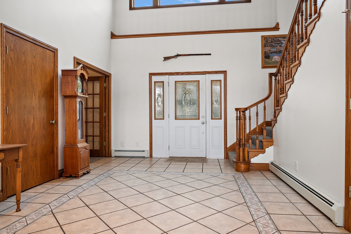 10739-451 North 1300 E Road Chenoa, IL 61726 - Photo 24 of 55 an entryway with wooden floor and stairs