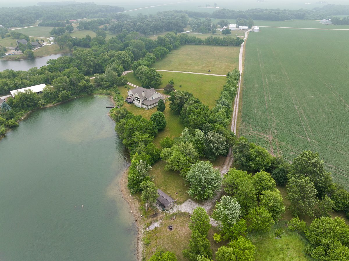 10739-451 North 1300 E Road Chenoa, IL 61726 - Photo 44 of 55 an aerial view of residential house with outdoor space and lake view