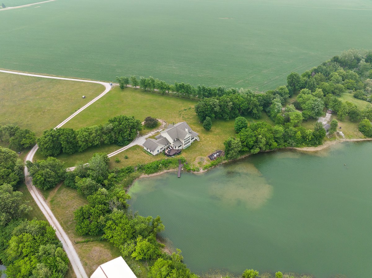 10739-451 North 1300 E Road Chenoa, IL 61726 - Photo 45 of 55 an aerial view of a house with a yard and lake view