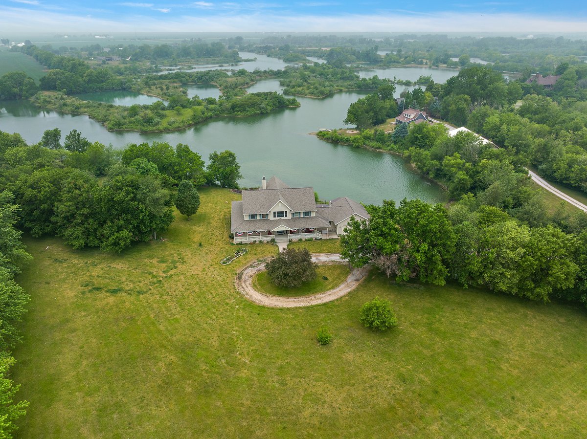 10739-451 North 1300 E Road Chenoa, IL 61726 - Photo 52 of 55 an aerial view of a house with a yard and lake view