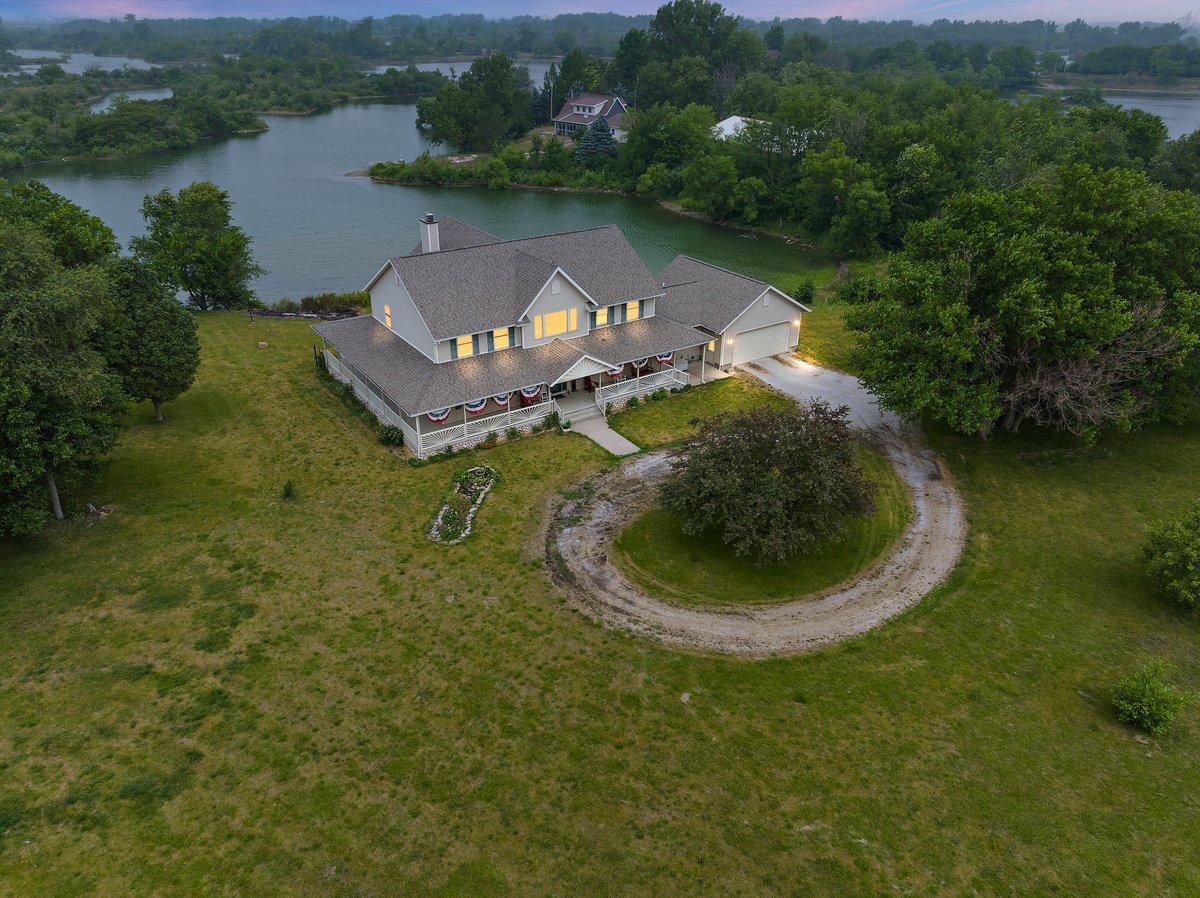 10739-451 North 1300 E Road Chenoa, IL 61726 - Photo 54 of 55 an aerial view of a house with outdoor space and a lake view