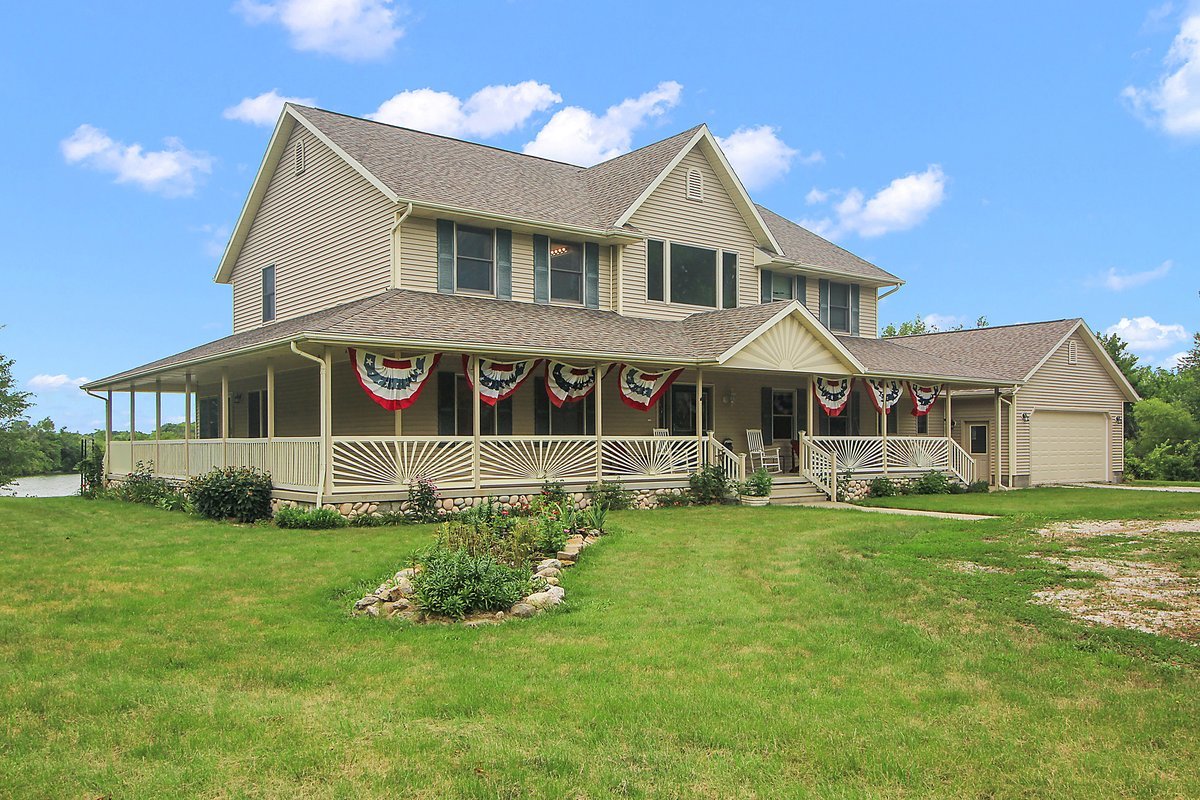10739-451 North 1300 E Road Chenoa, IL 61726 - Photo 55 of 55 a front view of a house with a yard table and chairs