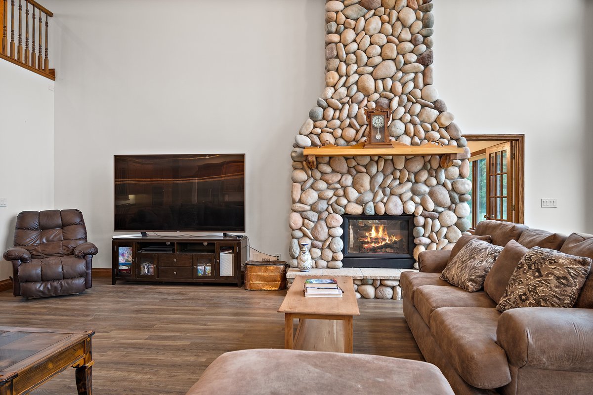 10739-451 North 1300 E Road Chenoa, IL 61726 - Photo 8 of 55 a living room with furniture a flat screen tv and a fireplace