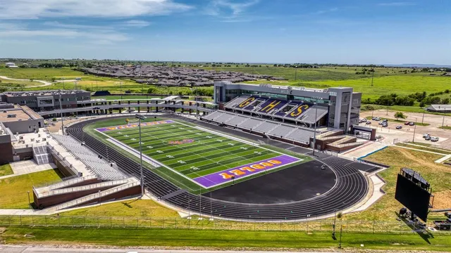 a view of a swimming pool with a lounge chair