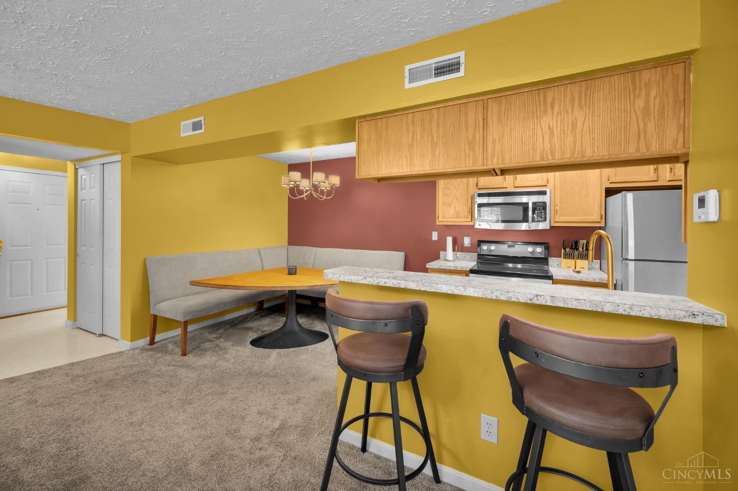 3543 Jessup Road, Unit 2B Cincinnati, OH 45239 - Photo 7 of 31 Functional open kitchen with breakfast seating and easy entertaining flow