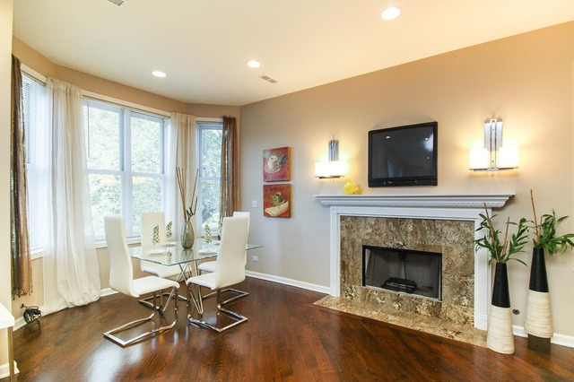 4115 South Drexel Boulevard, Unit 2F Chicago, IL 60653 - Photo 6 of 17 a living room with furniture a fireplace and a flat screen tv
