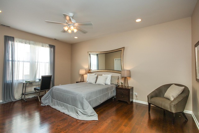 4115 South Drexel Boulevard, Unit 2F Chicago, IL 60653 - Photo 10 of 17 a bedroom with a bed and a chair