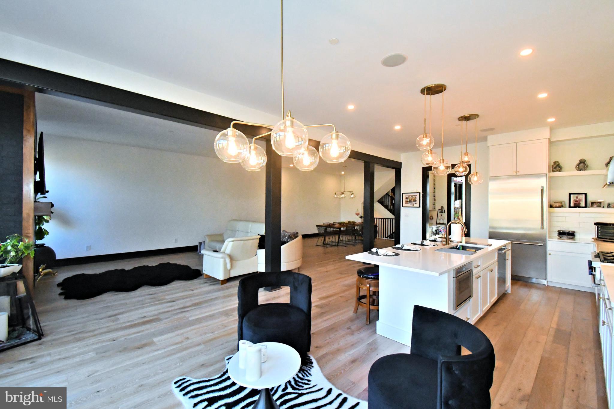 10 Richards Way Ambler, PA 19002 - Photo 19 of 73 a living room with fireplace furniture and a wooden floor