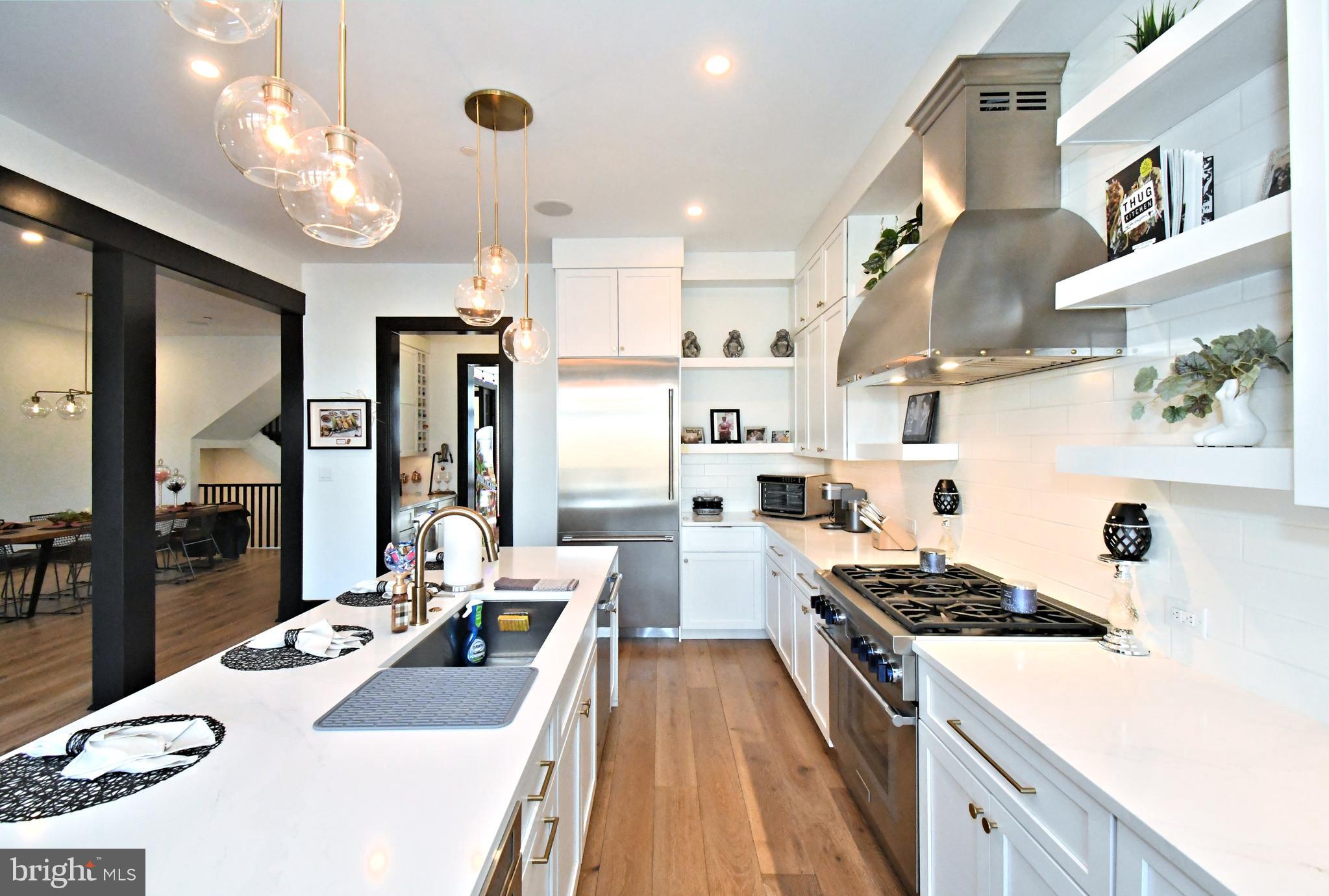 10 Richards Way Ambler, PA 19002 - Photo 21 of 73 a kitchen with stainless steel appliances a stove a sink dishwasher and cabinets with wooden floor