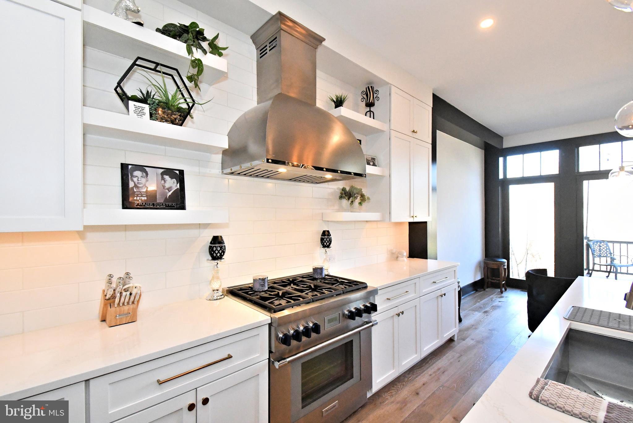 10 Richards Way Ambler, PA 19002 - Photo 26 of 73 a kitchen with granite countertop stainless steel appliances stove top oven and cabinets