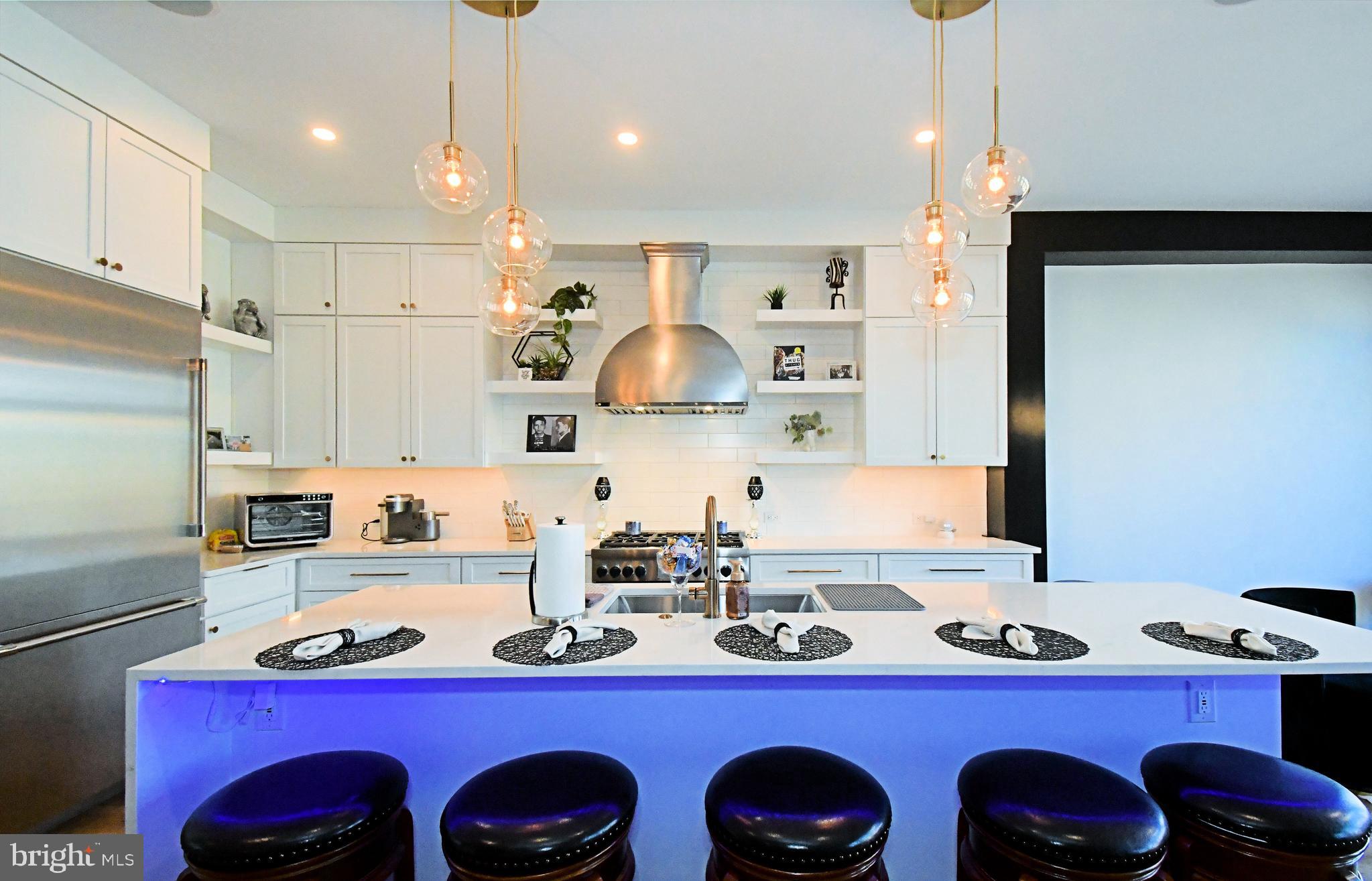 10 Richards Way Ambler, PA 19002 - Photo 27 of 73 a kitchen with stainless steel appliances a sink a table and chairs