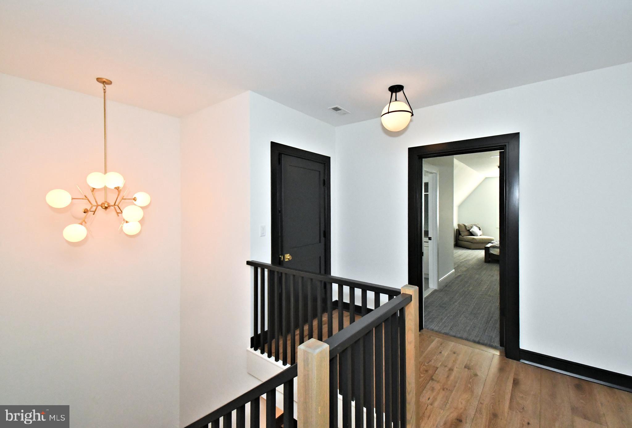 10 Richards Way Ambler, PA 19002 - Photo 31 of 73 a view of a hallway with wooden floor and staircase
