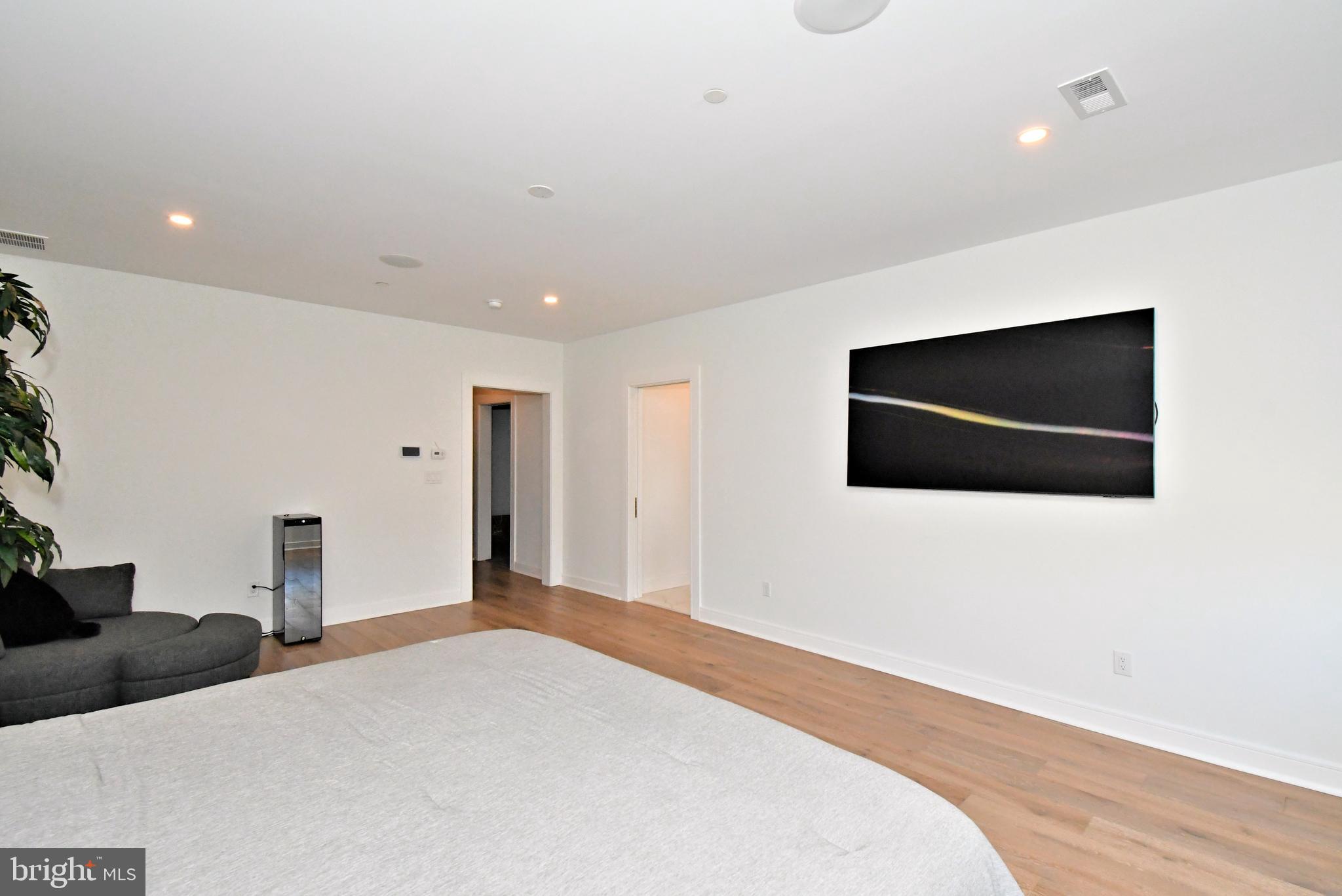 10 Richards Way Ambler, PA 19002 - Photo 35 of 73 a bedroom with a bed and a flat screen tv