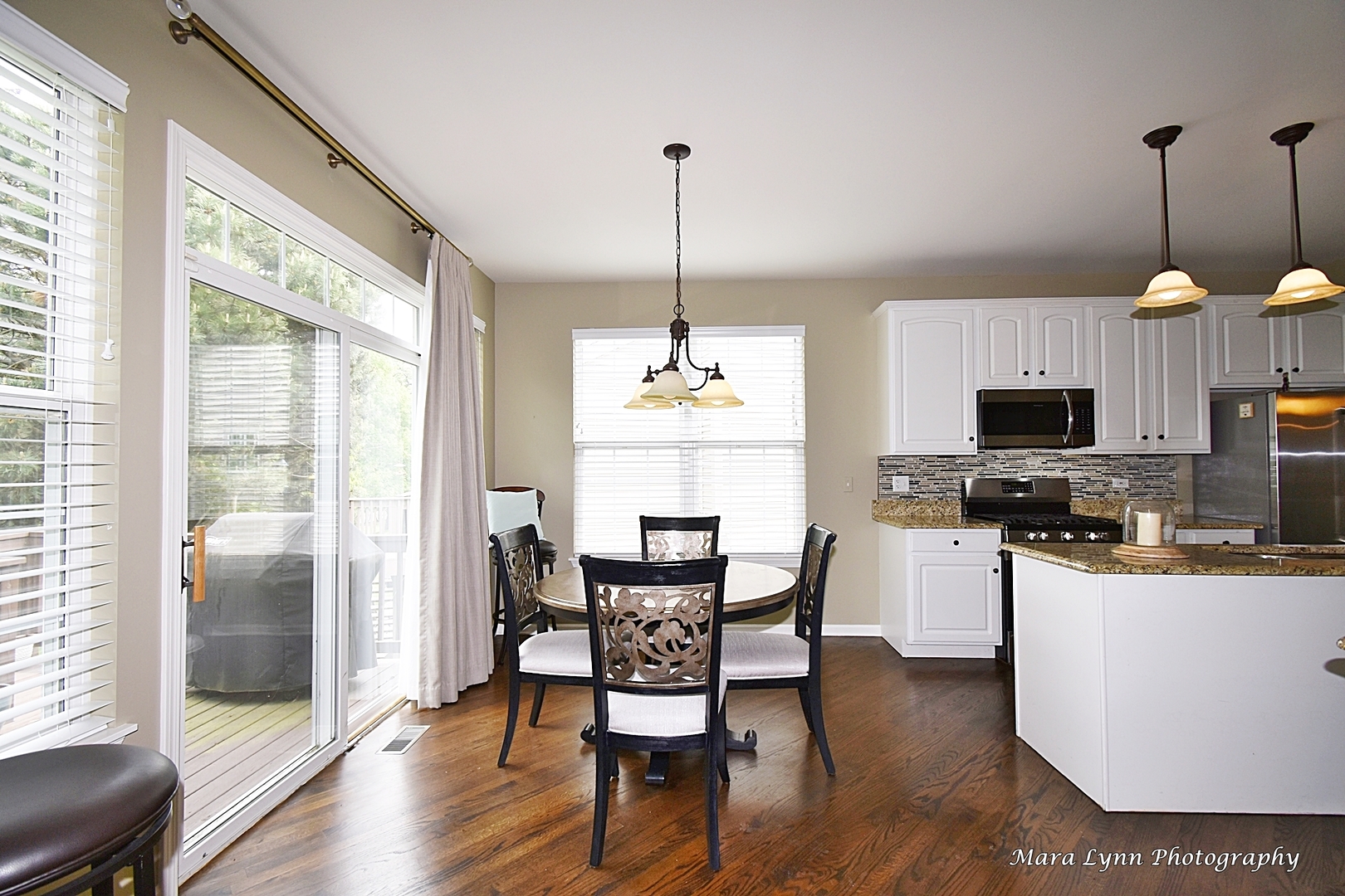 714 Viewpointe Drive St. Charles, IL 60174 - Photo 10 of 31 a view of a dining room with furniture window and wooden floor