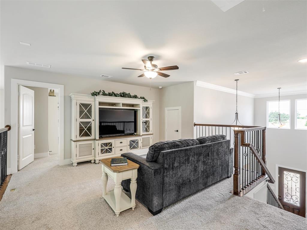 544 Majors Road Van Alstyne, TX 75495 - Photo 22 of 36 a living room with furniture and a flat screen tv