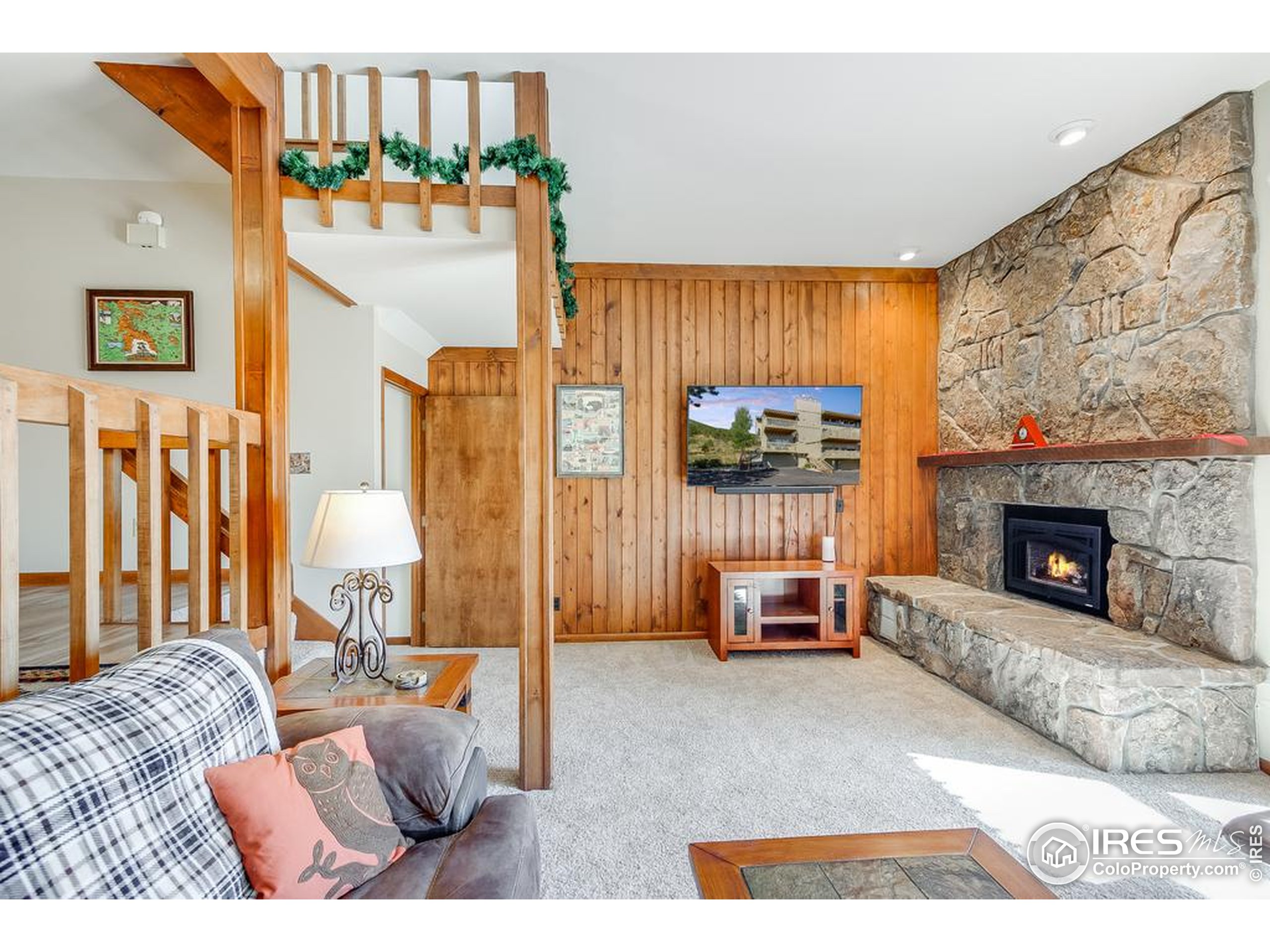 1070 Crestview Court, Unit 4 Estes Park, CO 80517 - Photo 5 of 28 a living room with furniture and a fireplace
