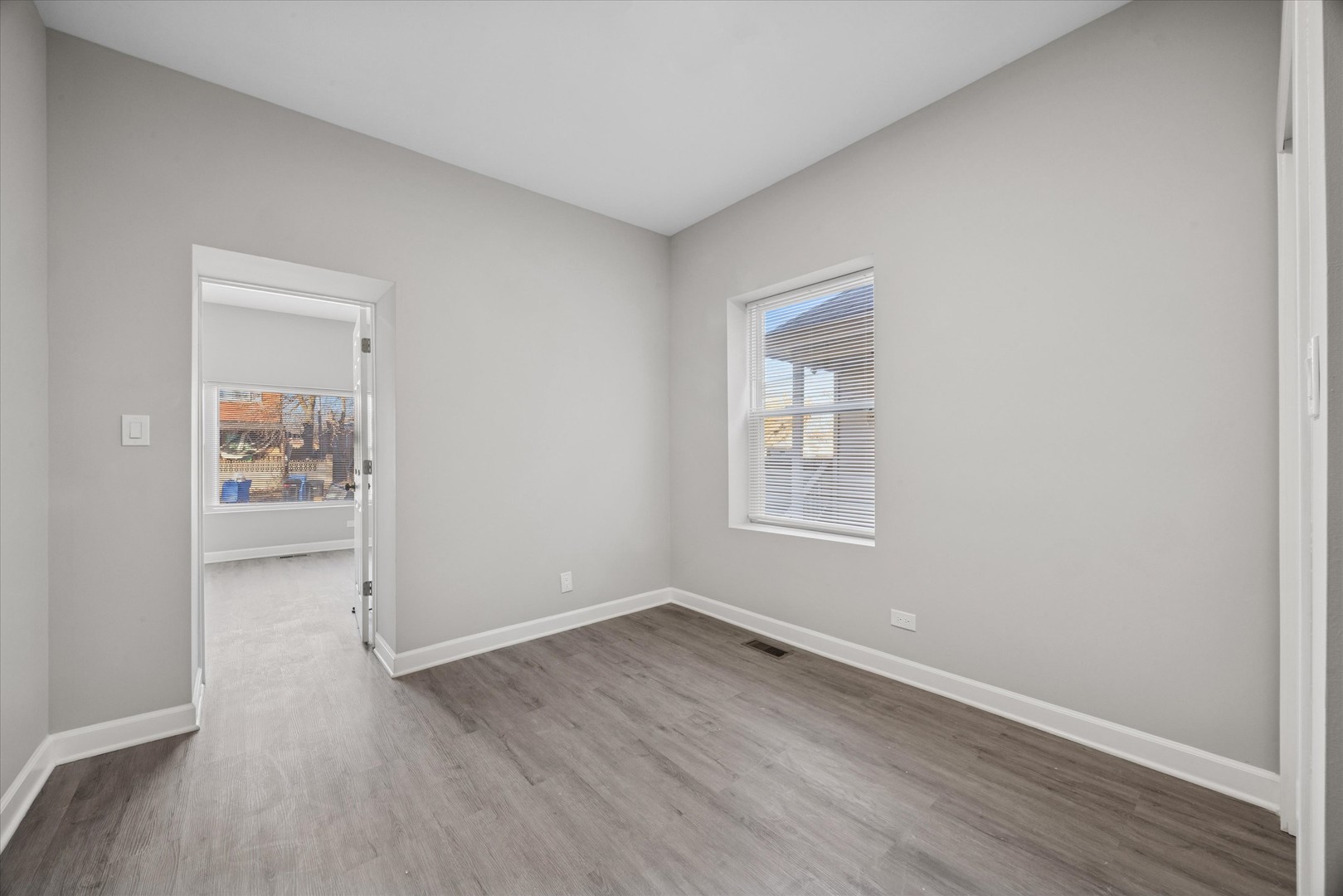 8018 South Harvard Avenue, Unit 2 Chicago, IL 60620 - Photo 11 of 14 wooden floor in an empty room