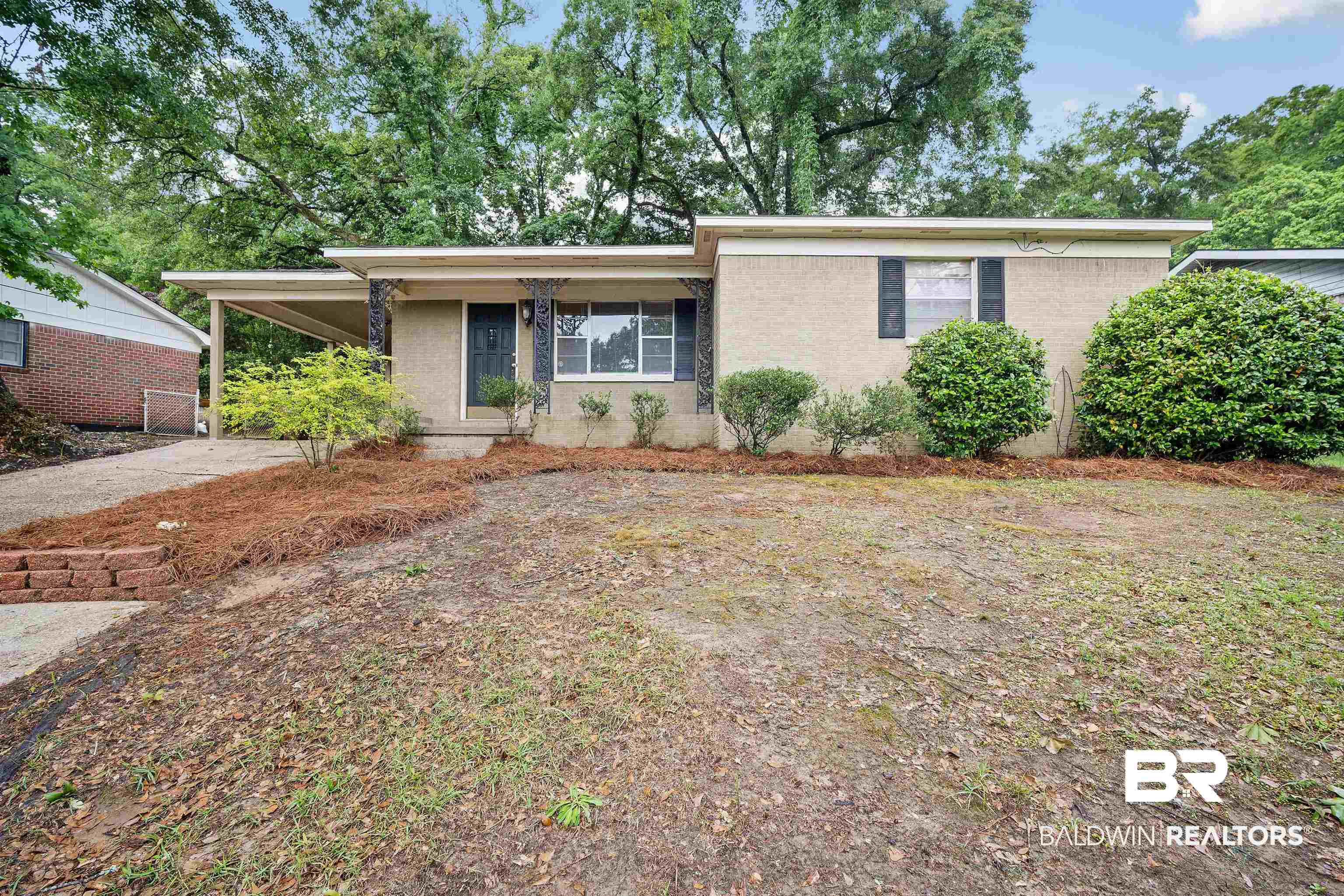 570 Markham Drive Mobile, AL 36609 - Photo 1 of 25 Ranch-style home featuring a carport and brick siding