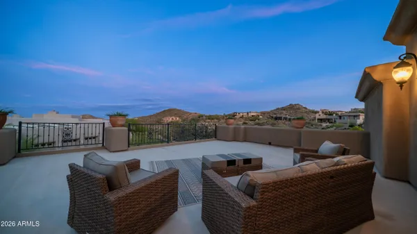 a view of swimming pool with outdoor seating