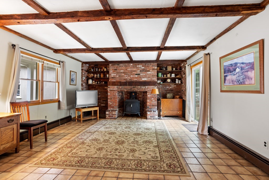110 Middle Road Boxborough, MA 01719 - Photo 16 of 33 a view of room with furniture and a fireplace