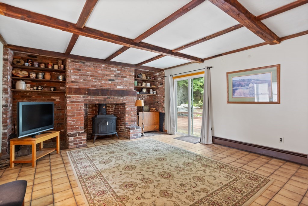110 Middle Road Boxborough, MA 01719 - Photo 17 of 33 a view of an empty room with a fireplace and a window