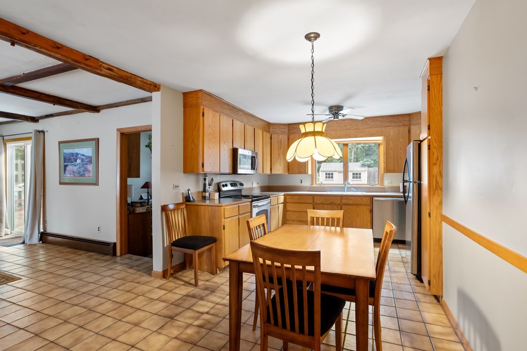 110 Middle Road Boxborough, MA 01719 - Photo 21 of 33 a view of a dining room with furniture window and wooden floor