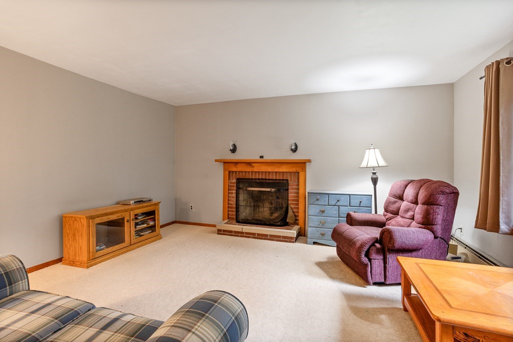 110 Middle Road Boxborough, MA 01719 - Photo 26 of 33 a living room with furniture and a fireplace