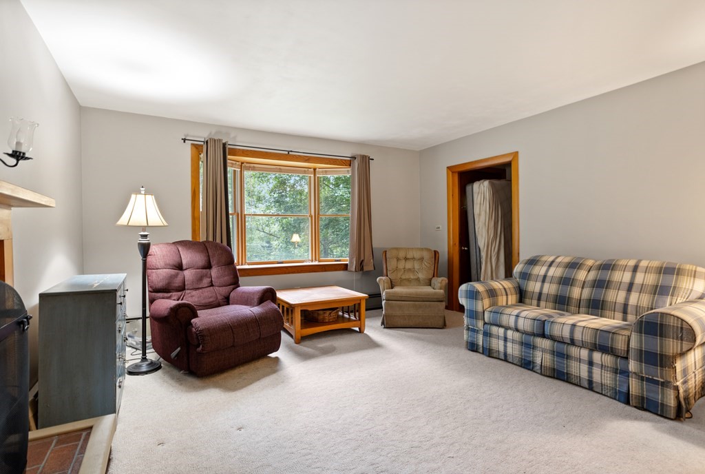 110 Middle Road Boxborough, MA 01719 - Photo 27 of 33 a living room with furniture and a large window