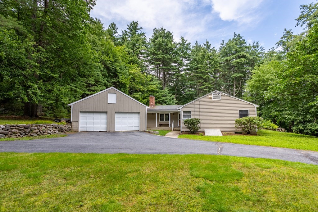 110 Middle Road Boxborough, MA 01719 - Photo 3 of 33 a front view of a house with a yard and trees