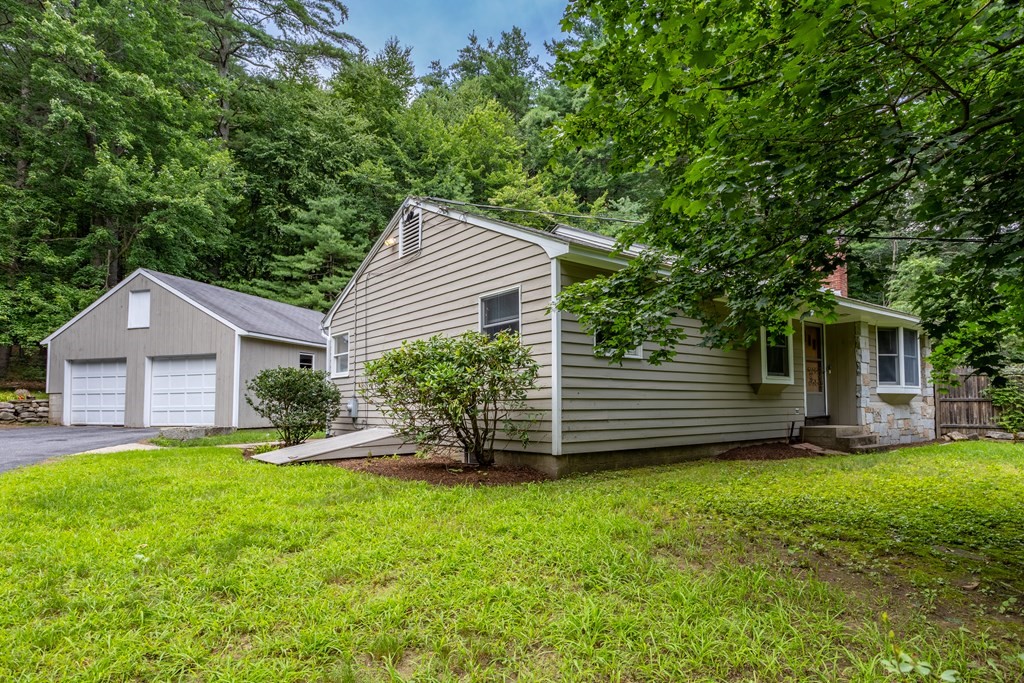 110 Middle Road Boxborough, MA 01719 - Photo 5 of 33 a view of a house with a yard and a large tree