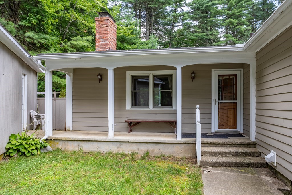 110 Middle Road Boxborough, MA 01719 - Photo 8 of 33 a front view of a house with a garden