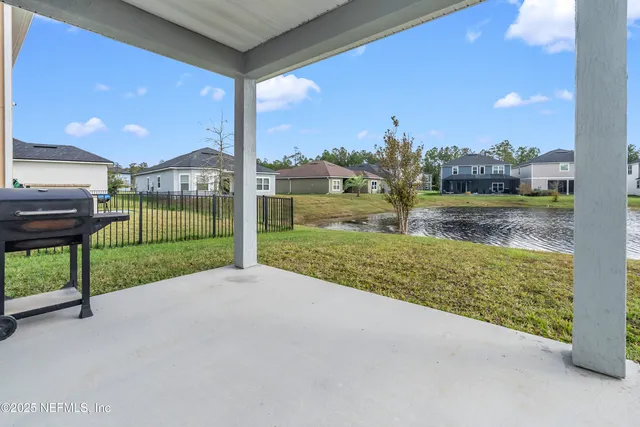 a view of a garden with an outdoor seating
