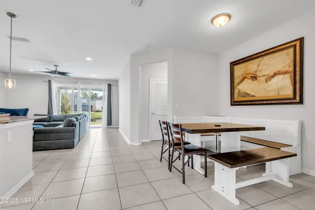 a view of a workspace with furniture and a potted plant