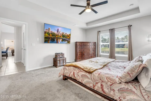 a bedroom with bed and window