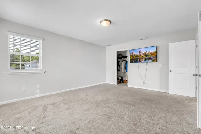 a view of empty room with windows