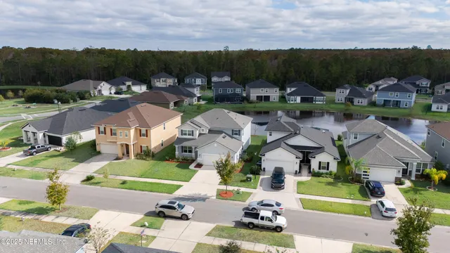 an aerial view of multiple houses with outdoor space