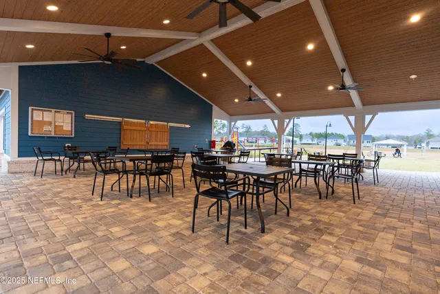 a group of people sitting at tables in a room