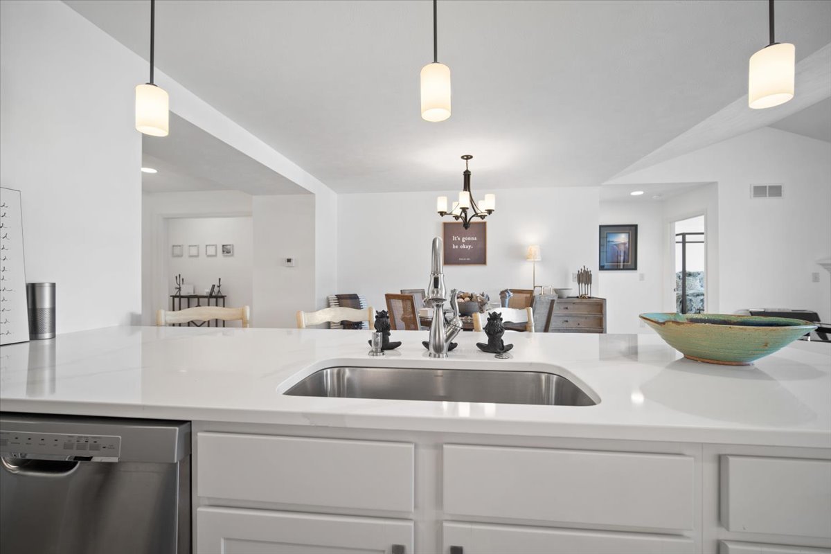 1423 Pine Forest Drive Normal, IL 61761 - Photo 12 of 23 a kitchen with a sink a counter space and a chandelier