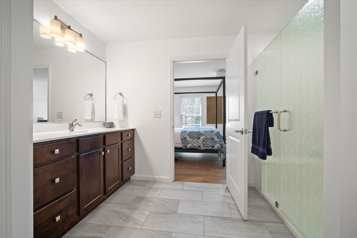 1423 Pine Forest Drive Normal, IL 61761 - Photo 15 of 23 a spacious bathroom with a shower a sink and mirror